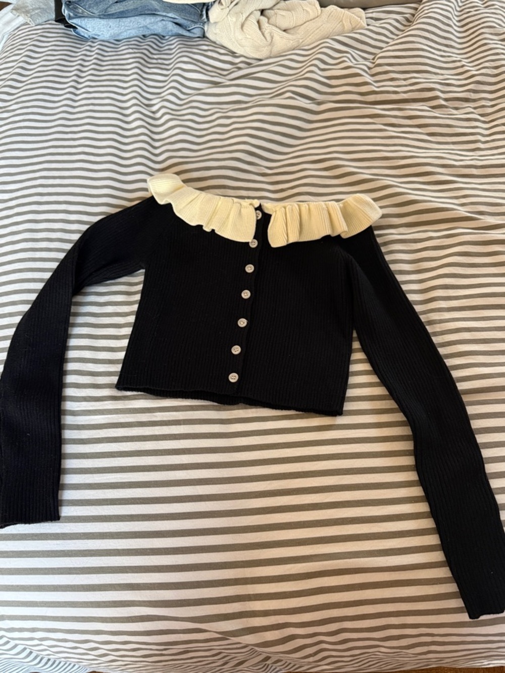 Black Ribbed Button-Up Cardigan with Cream Ruffle Collar
